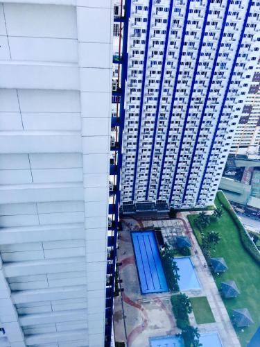 an overhead view of a tall building with blue doors at SMDC Light Residences Condominium in Manila