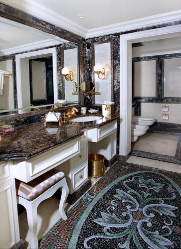 a bathroom with a sink and a toilet at Bentley London in London