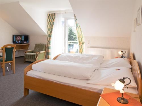 Katil atau katil-katil dalam bilik di Hotel Restaurant Schute