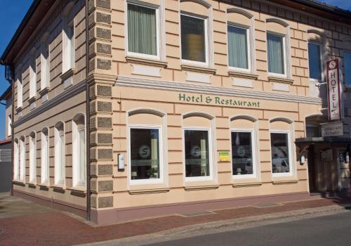 a building on the side of a street at Hotel Restaurant Schute in Emstek