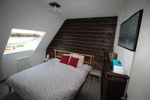 En eller flere senge i et værelse på Tribord la Maison de l'âne