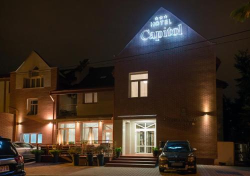 a hotel carillon sign on the side of a building at Hotel Capitol in Biała Podlaska
