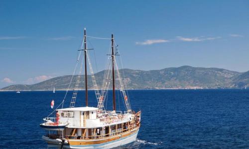 a boat in the middle of a large body of water at Apartments Villa Bare in Kastav