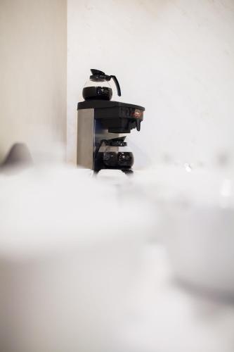 a machine sitting on top of a white wall at Hotel Wodnik in Bydgoszcz