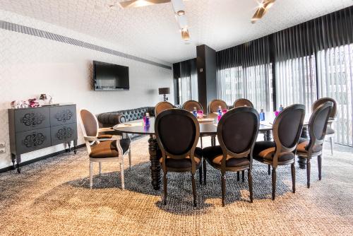 a conference room with a table and chairs at Barceló Raval in Barcelona