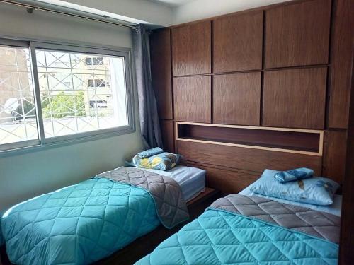 Ein Bett oder Betten in einem Zimmer der Unterkunft Ghazi Appartement