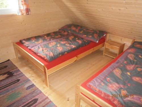 Postel nebo postele na pokoji v ubytování Drevenica Silvia