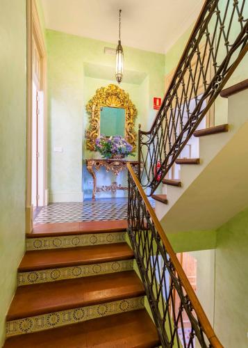 a staircase in a home with a painting on the wall at The Salvia - Adults Only in Sóller