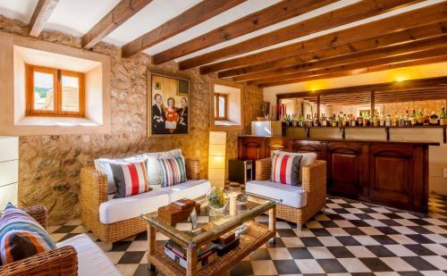 a living room with two couches and a bar at The Salvia - Adults Only in Sóller