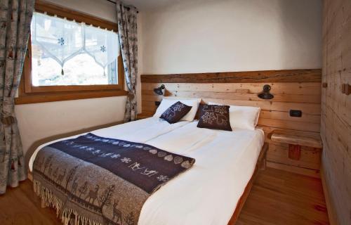 Postel nebo postele na pokoji v ubytování Chalet Teo e Marianna