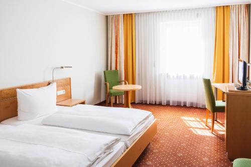 Postel nebo postele na pokoji v ubytování Hotel Rad
