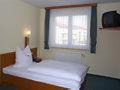 Postel nebo postele na pokoji v ubytování Hotel am Platz