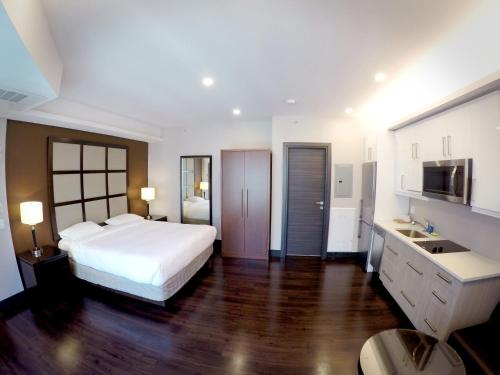 Ένα ή περισσότερα κρεβάτια σε δωμάτιο στο M Montreal Hostel
