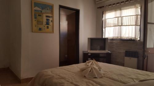 Кровать или кровати в номере Antigua Fonda Hosteria