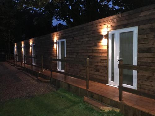 a row of windows on a house at night at The Half Moon Inn in Goole