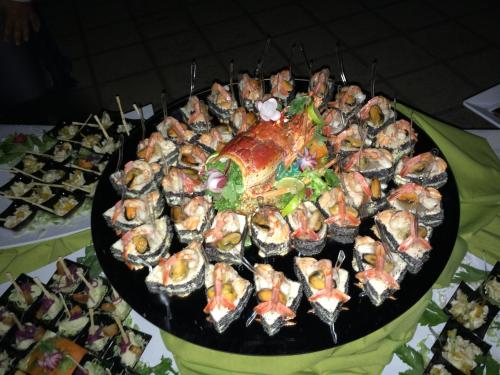 a large platter of food on a table at Riviera Hotel in Enna