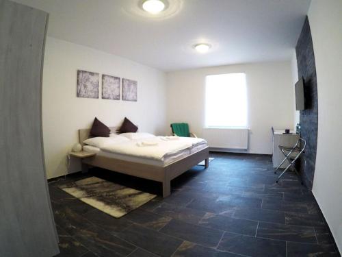Ένα ή περισσότερα κρεβάτια σε δωμάτιο στο Penzion U tri statkaru