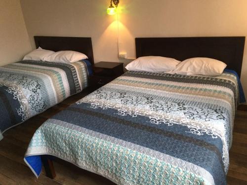Ένα ή περισσότερα κρεβάτια σε δωμάτιο στο Hostal la Merced