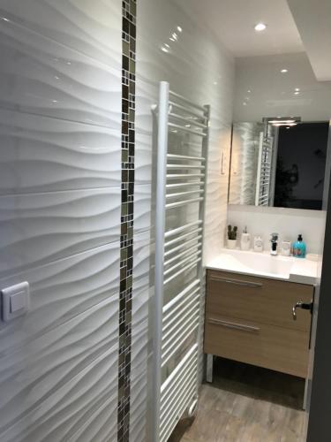 a bathroom with a shower and a sink at le petit bateau in Menton