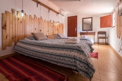 מיטה או מיטות בחדר ב-Beja Hostel