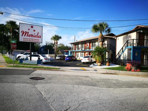 a motel sign on the corner of a street at Merida Inn & Suites in Saint Augustine