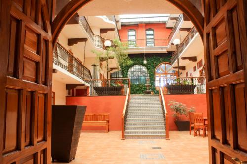 an open hallway with stairs in a building at Hotel Santa Fe in Tlatlauquitepec
