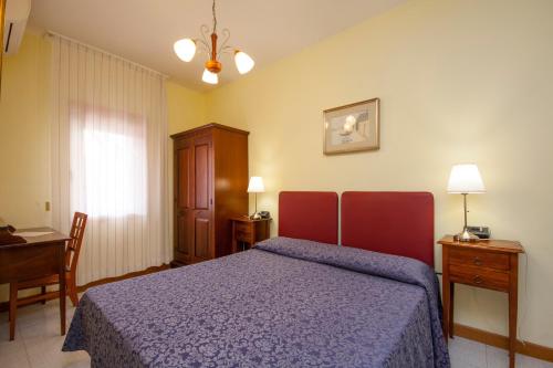Cama o camas de una habitación en Hotel dalla Mora