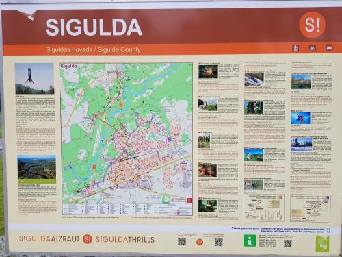 a map of the sights of sigulda on a sign at Holiday Home Ermine in Sigulda