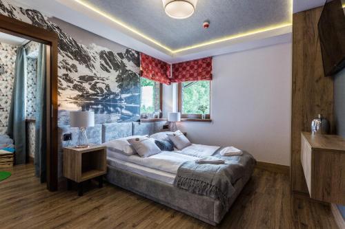 Postel nebo postele na pokoji v ubytování Aparthotel Góralski Spa & Restaurant