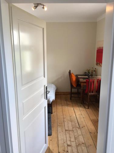 a door leading into a room with a table at finkeshaus in Lüdinghausen