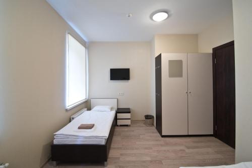Postel nebo postele na pokoji v ubytování Bella Riga Hotel with Self-Check in
