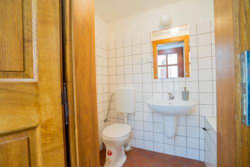 a bathroom with a toilet and a sink at Studio Ztracená 8 in Olomouc