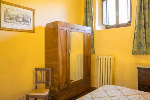 Ένα ή περισσότερα κρεβάτια σε δωμάτιο στο Villa Grassina