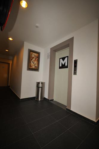 a hallway of a building with a sign on the wall at M Design Hotel @ Pandan Indah in Kuala Lumpur