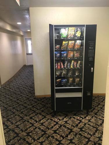a refrigerator filled with food in a hallway at Super 8 by Wyndham Bridgeview of Mackinaw City in Mackinaw City