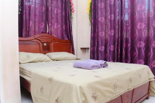 Letto o letti in una camera di Julz Tropical Apartments