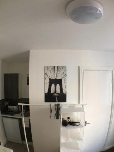 a white refrigerator in a kitchen with a picture on the wall at Parsons Street in Dudley