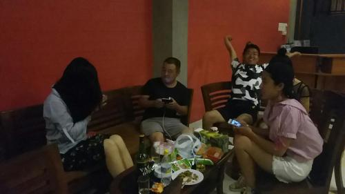a group of people sitting in a room at Marine Hostel at Negombo Beach Near Airport in Negombo