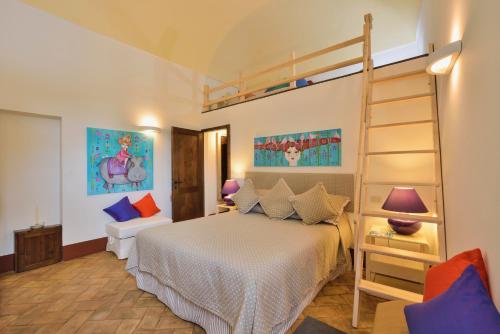 a bedroom with a bed and a bunk bed at Alberto Charming Home in Montepulciano