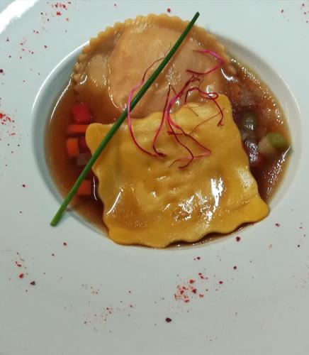 a plate of food on a white plate at Hostellerie Sainte-Cécile in Florenville