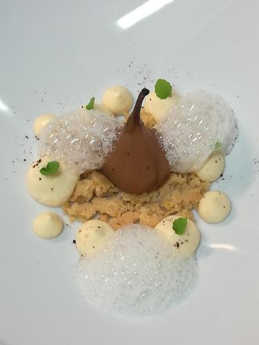 a plate of food with ice cream and chocolate on it at Hostellerie Sainte-Cécile in Florenville