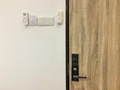 a close up of a wooden door with a locking mechanism at iBook Gurney Suites in George Town