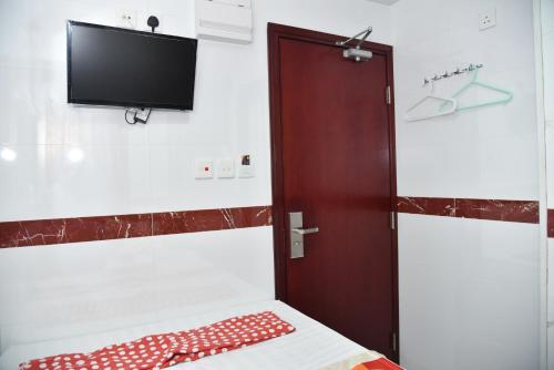 Cama ou camas em um quarto em Traveller's Hostel