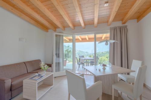 a living room with a couch and a table at Villa Maria in Tremosine Sul Garda