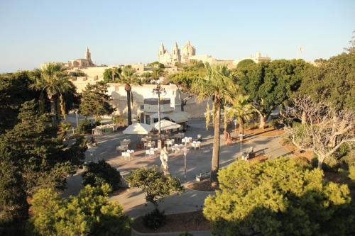 an overhead view of a park with palm trees at Maleth Inn in Rabat