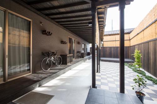 a bike is parked on the side of a building at Fujitaya BnB in Kyoto
