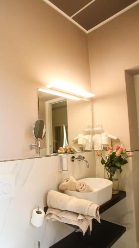 a bathroom with a sink and a mirror at Grand Hotel Tettuccio in Montecatini Terme