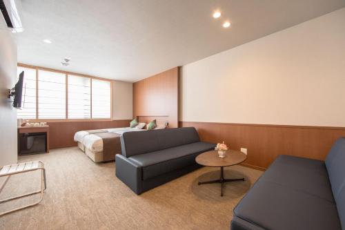 a living room with a couch and a bed at Number 6 Nijo in Kyoto