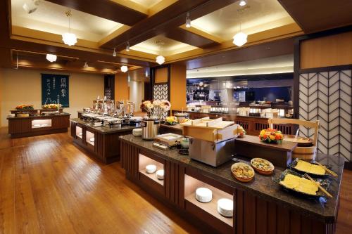 a restaurant with a buffet line with food on display at Shoho in Matsumoto