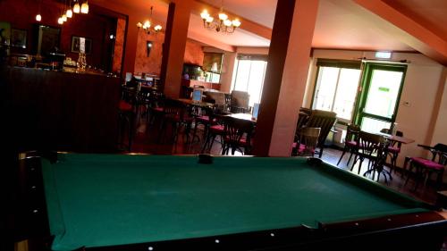 
a green and white bar in a room at Jubilee Hotel Troodos in Troodos
